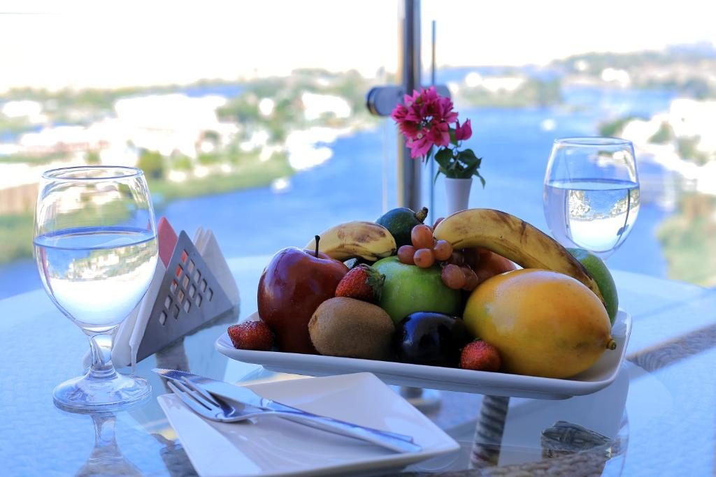 Fruit platter on a table with the Nile in the background