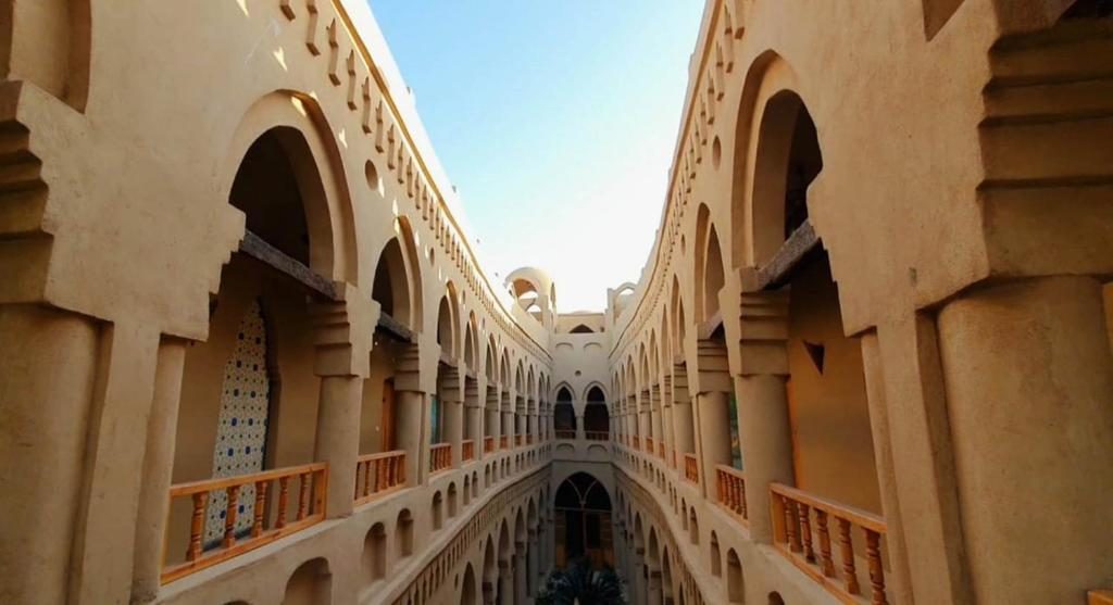 Arched galleries rising around the central courtyard
