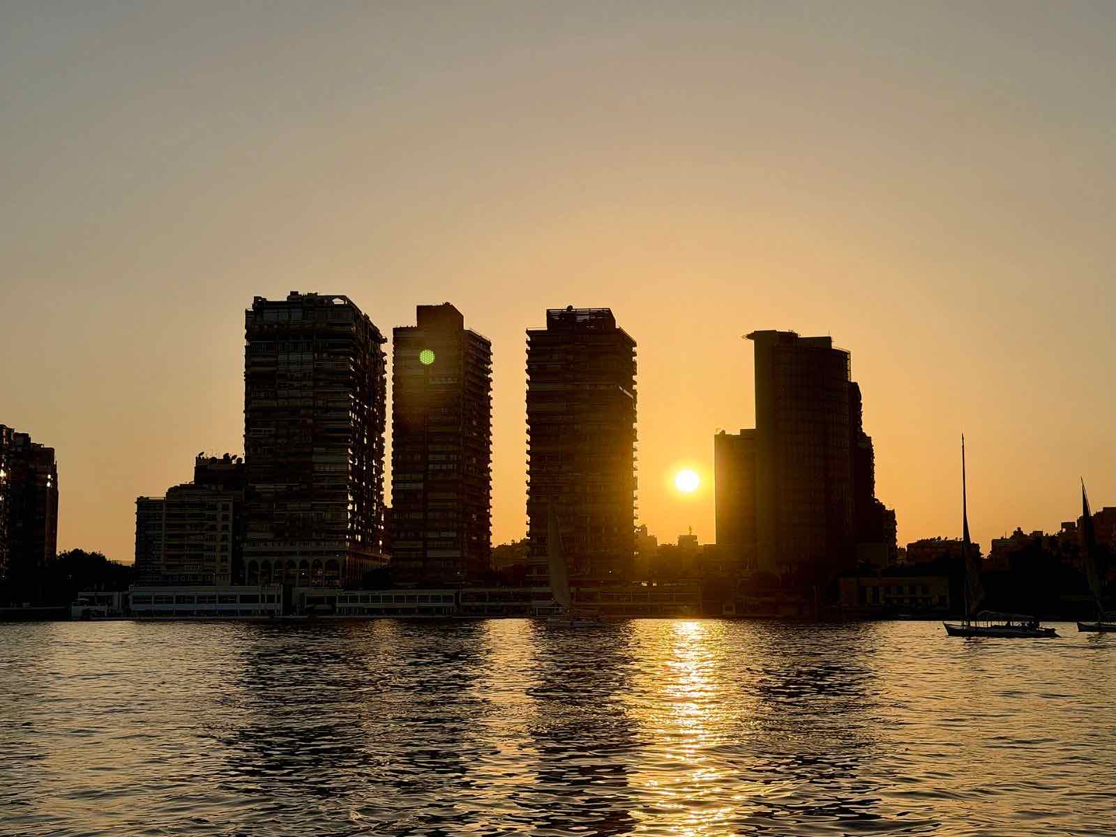 The sun setting over the Nile and the Cairo skyline
