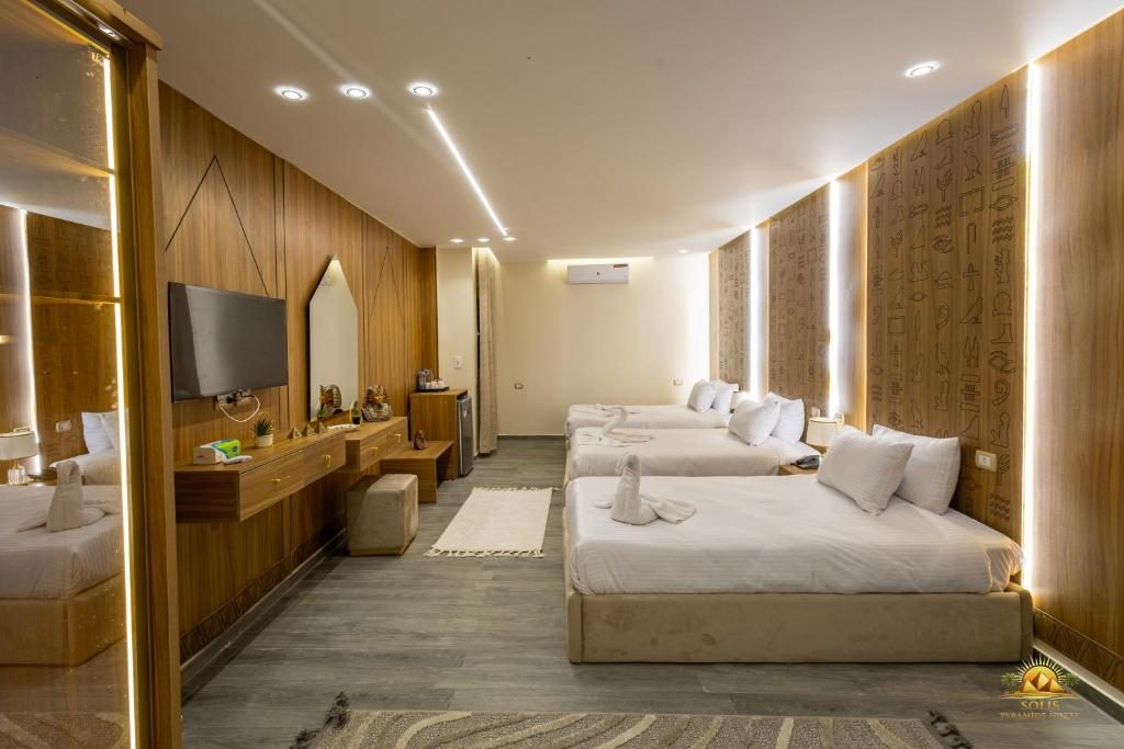 Large shared room with hieroglyph-carved timber walls