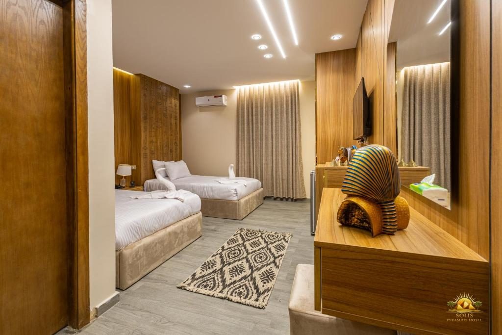 Twin room with warm timber panelling