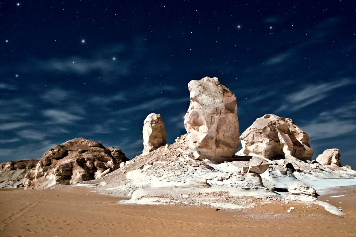 White Desert chalk formations under a starry night sky